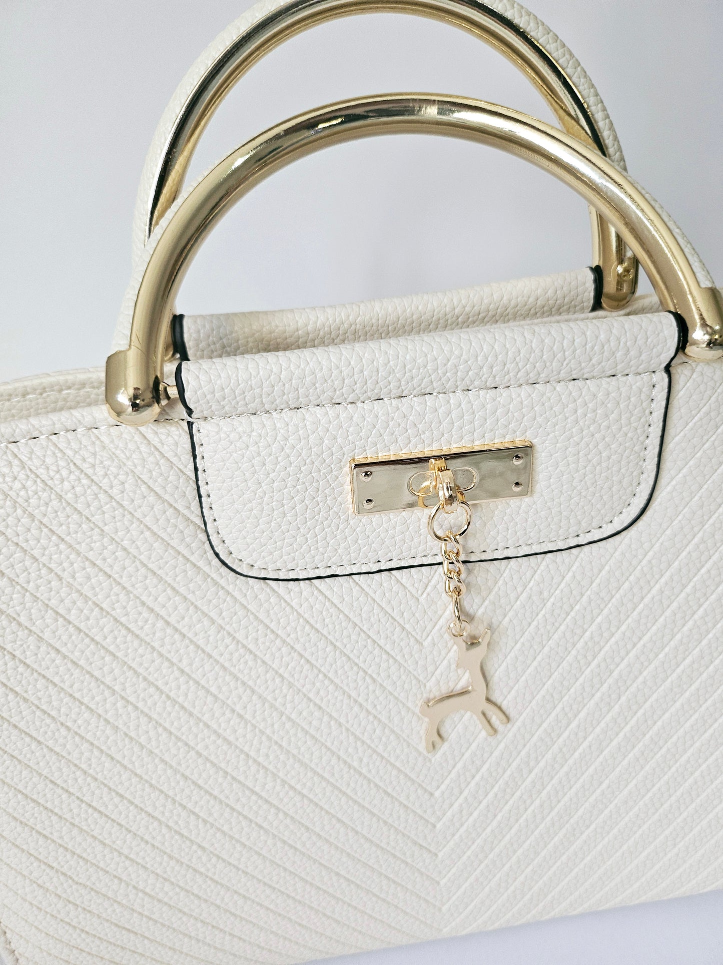 White Handbag with Deer Pendant