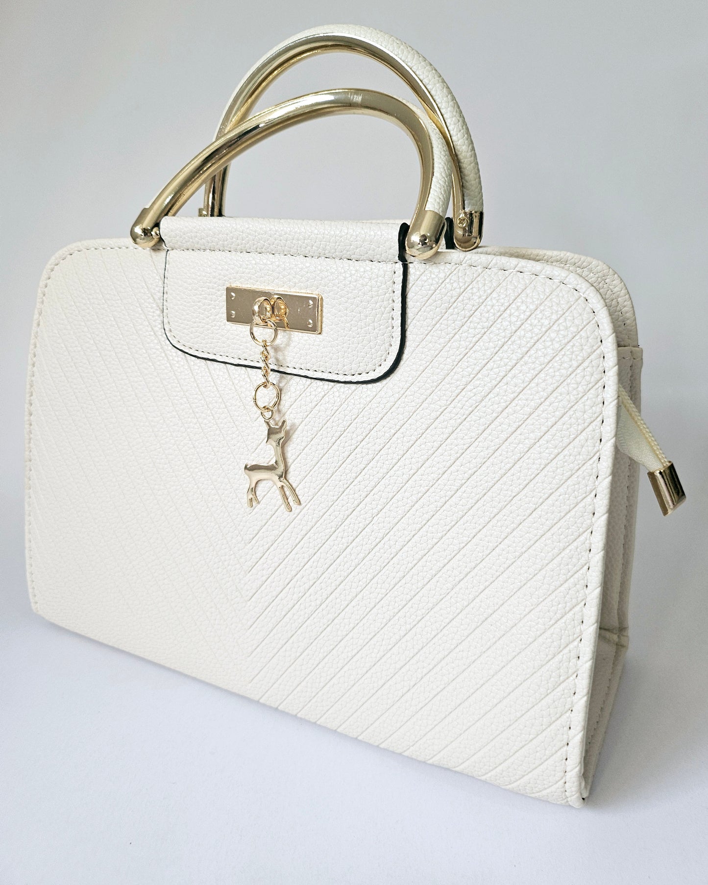 White Handbag with Deer Pendant