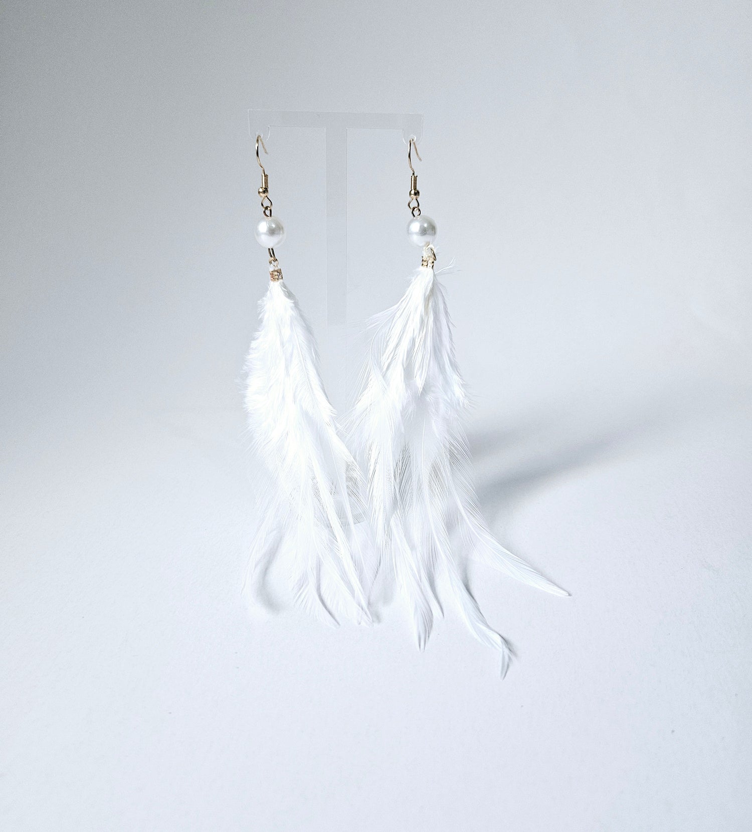 Pearl and white feather drop earring