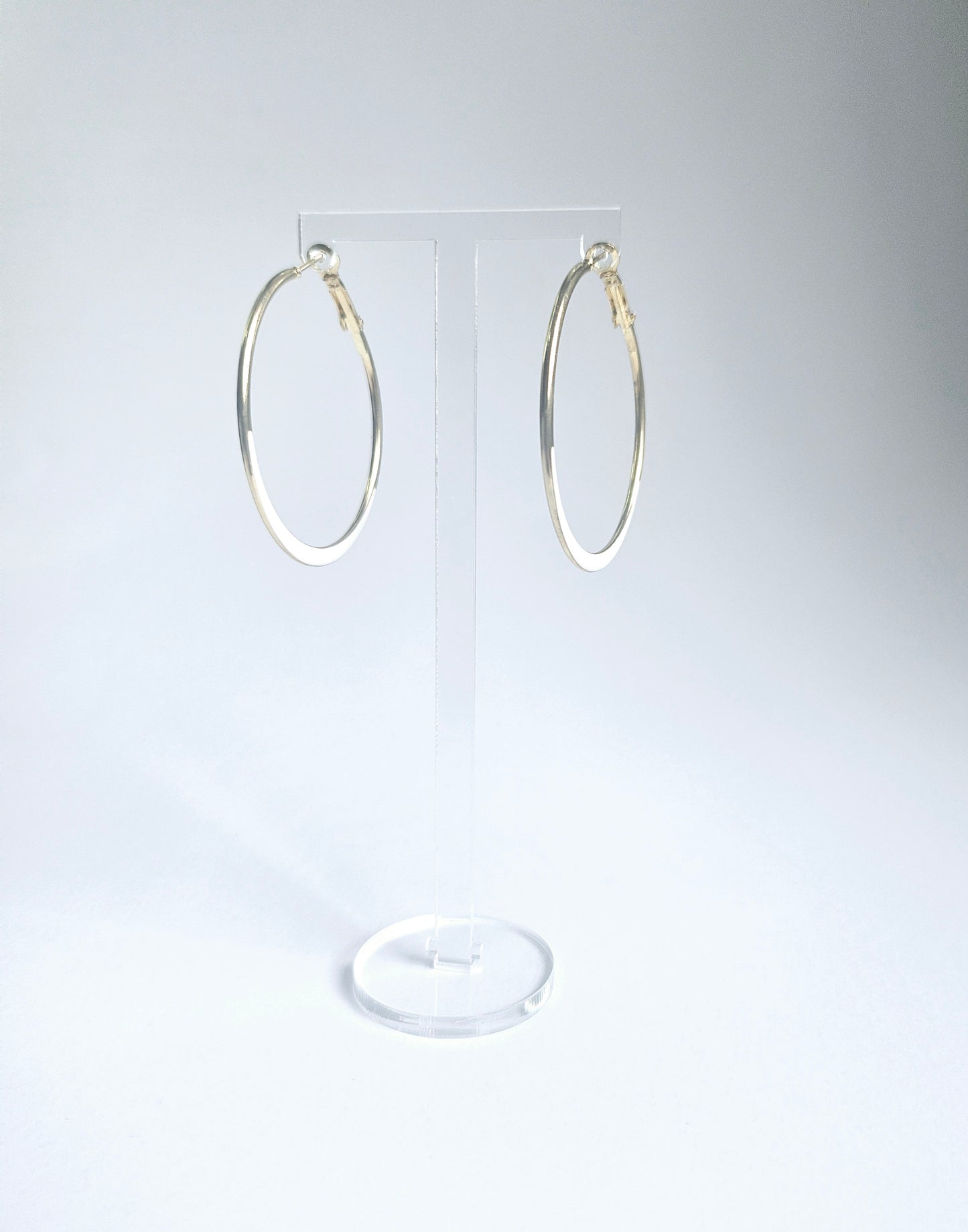 White and gold hoop earring