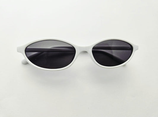 White framed sunglasses with dark lenses on a light gray background