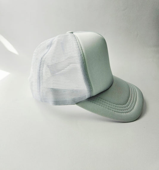 White baseball cap with mesh back on a white background